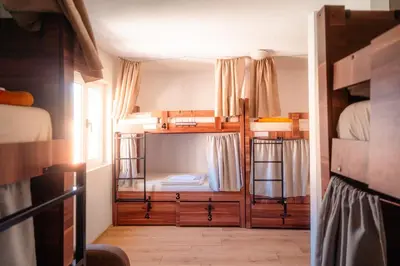 a room with two bunk beds and a window at FREEDOM HOSTEL in Budva