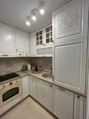 a white kitchen with white cabinets and a sink at Casa Vecchia in Kotor