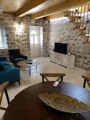 a living room with a couch and a table at Casa Vecchia in Kotor
