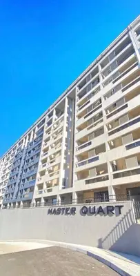 a large white apartment building on the beach at Apartman Ana Lux in Podgorica