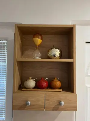 a wooden cabinet with bowls and vases on it at Dolce Casa in Kotor