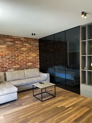 a living room with a couch and a table at Anja & Ogo apartments with Pool _ in Petrovac na Moru
