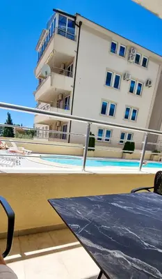 a view of a building and a swimming pool at Anja & Ogo apartments with Pool _ in Petrovac na Moru