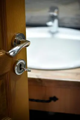 an open door with a sink in the background at Lake Valley in Virpazar