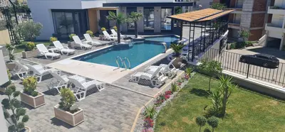 an overhead view of a swimming pool with chairs and tables at SeaView Apartment & Pool in Ulcinj