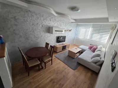 a living room with a couch and a table at DUBLIN STAN na dan u MARŠALA TITA in Bar