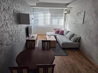 a living room with a couch and a table at DUBLIN STAN na dan u MARŠALA TITA in Bar
