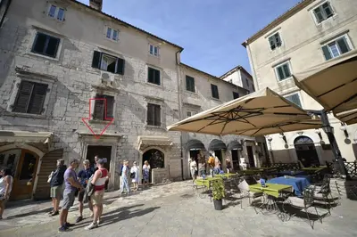 a group of people standing in front of a building at Apartment Filip in Kotor