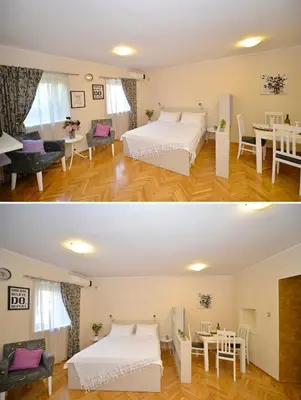 a room with two beds and a dining room at Apartment Filip in Kotor
