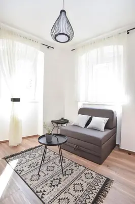 a living room with a couch and a table at Sambra old town apartment in Budva