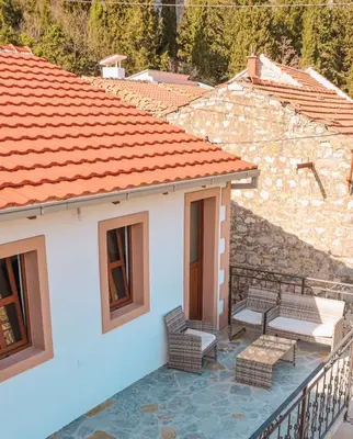 a balcony of a house with benches on it at Apartmani Dumezic in Bar