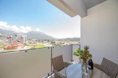 a balcony with a table with a view of a city at Un posto al sole in Bar