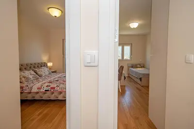 a bedroom with a bed and a living room at Un posto al sole in Bar