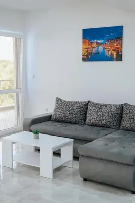 a living room with a couch and a coffee table at Apartmani Panorama in Bar