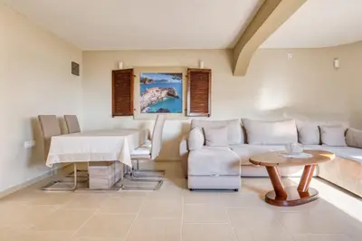 a living room with a couch and a table at SAVOVIC_LUX in Petrovac na Moru