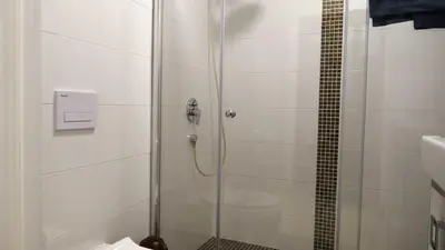 a shower with a glass door in a bathroom at Lux Seky with Pool in Dobra Voda