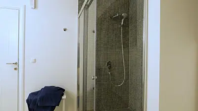 a bathroom with a shower with a glass door at Lux Seky with Pool in Dobra Voda