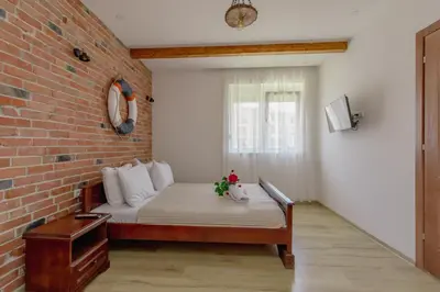a small room with a bed in a brick wall at Medo in Ulcinj