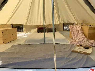 a large tent with a bed in it at Bigova Glamping in Kotor