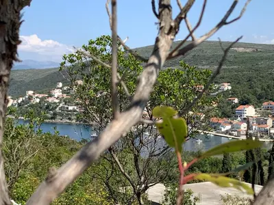 a view of a town and a body of water at Bigova Glamping in Kotor
