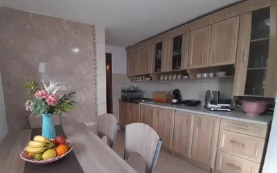 a kitchen with a table with a bowl of fruit at Villa Dedin in Utjeha
