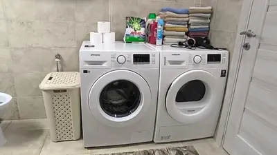 a washing machine and a washer in a bathroom at Liprosh in Virpazar
