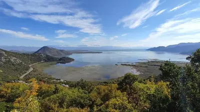 a view of a lake with mountains in the background at Liprosh in Virpazar