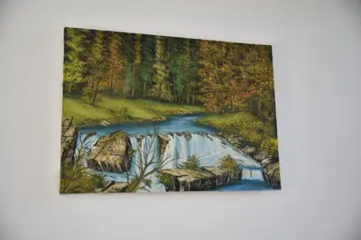 a painting of a river in a forest at Apartments kupi ul rudaj 41 in Ulcinj