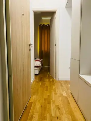 a hallway with wooden floors in a room at Apartment DORA in Cetinje