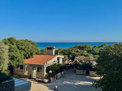 a house with a view of the ocean at Beachfront Hotel Palma - Jaz in Budva