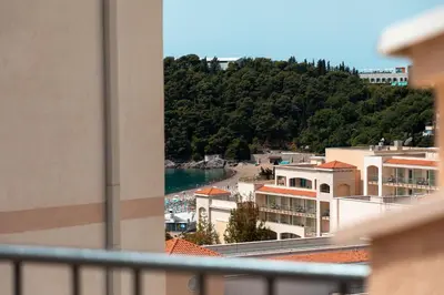 a view of a beach from a balcony of a building at Porta Volta Residence in Becici