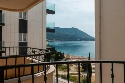 a balcony with a view of the water at Porta Volta Residence in Becici
