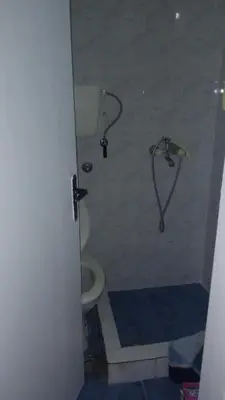 a bathroom with a shower with a toilet in it at Two in Petrovac na Moru