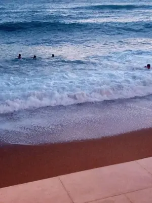 a group of people in the water at the beach at Two in Petrovac na Moru