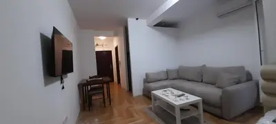 a living room with a couch and a table at Apartment Luka in Podgorica