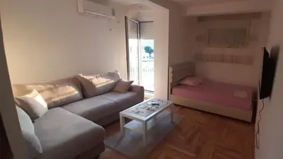 a living room with a couch and a table at Apartment Luka in Podgorica