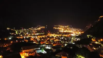 a view of a city at night with lights at Vukićević House in Kotor