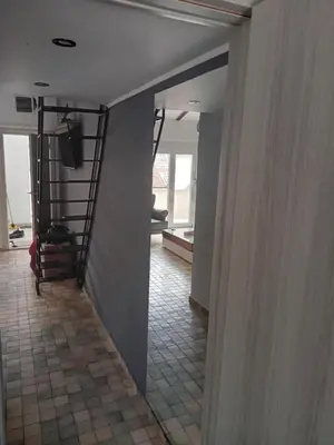 a hallway with a staircase in a house at Budva stan Natasa in Budva