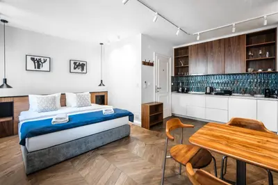 a bedroom with a bed and a wooden table at Nest Ozana in Kotor