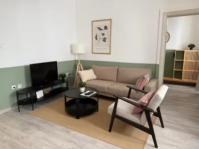 a living room with a couch and a table at Nest Ozana in Kotor