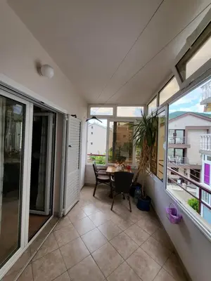 a balcony with a table and some windows at Family apartment Maxema in Budva