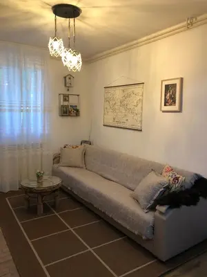 a living room with a couch and a table at Mountain house Ivanova Korita in Cetinje
