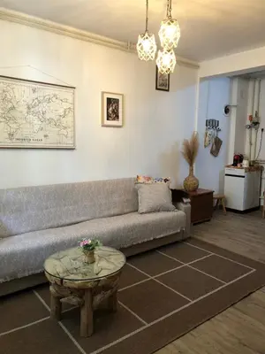 a living room with a couch and a table at Mountain house Ivanova Korita in Cetinje