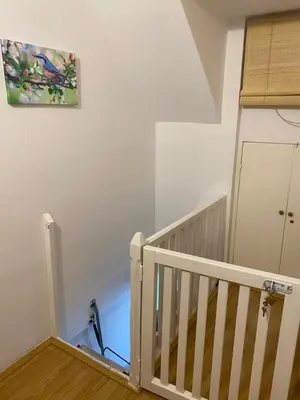 a room with a staircase and a painting on the wall at Mountain house Ivanova Korita in Cetinje