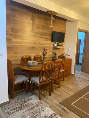 a dining room with a table and chairs at Mountain house Ivanova Korita in Cetinje
