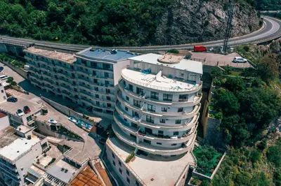 an overhead view of a tall building with a highway at Alex Lux sea view apartment 1 in Rafailovici