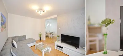 a living room with a couch and a tv at Unico apartman in Kotor