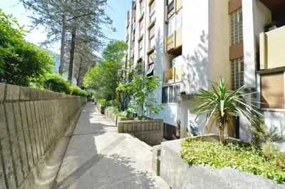 an empty sidewalk next to a building at Unico apartman in Kotor