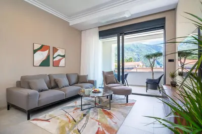 a living room with a couch and a table at C Group apartments in Kotor