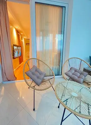 two chairs and a table in a room at Apartment Hana in Bar